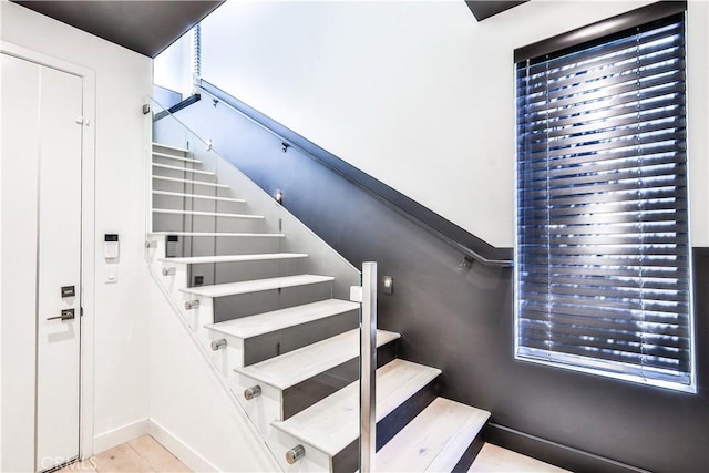 stairs with tile patterned floors