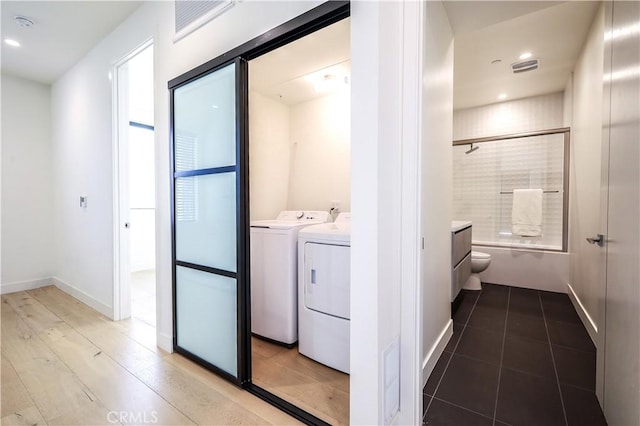 laundry area with separate washer and dryer