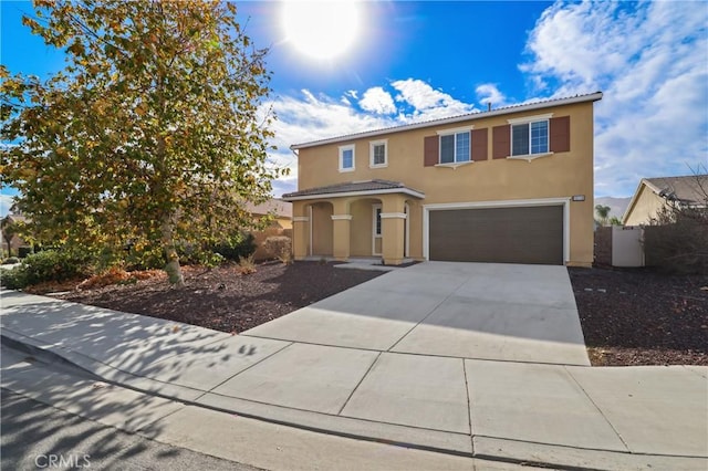 view of front of property with a garage