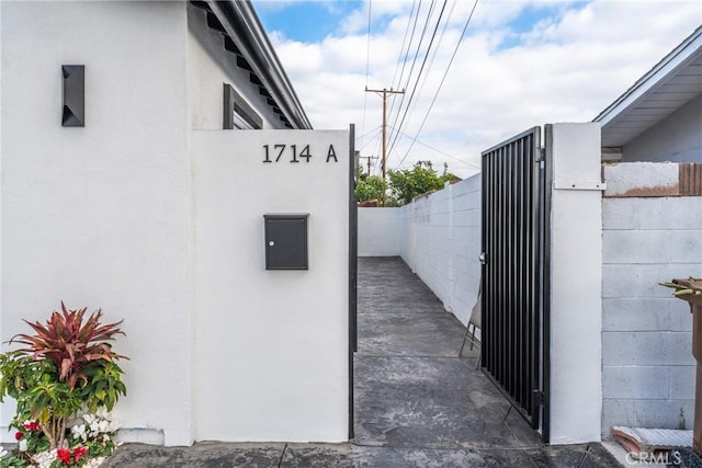 view of gate with fence