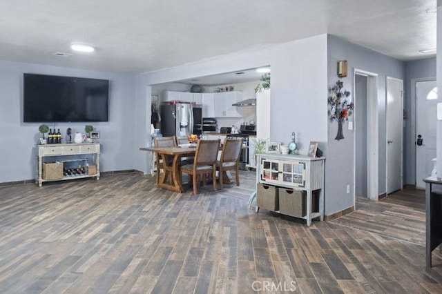 dining area featuring dark hardwood / wood-style flooring