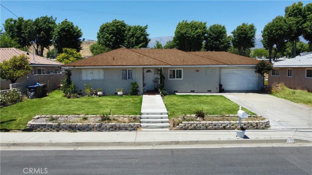 single story home with a front lawn and a garage