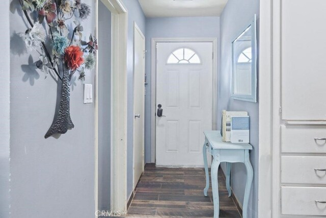 doorway to outside featuring dark hardwood / wood-style floors