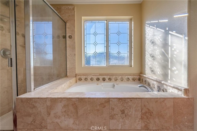 bathroom featuring shower with separate bathtub