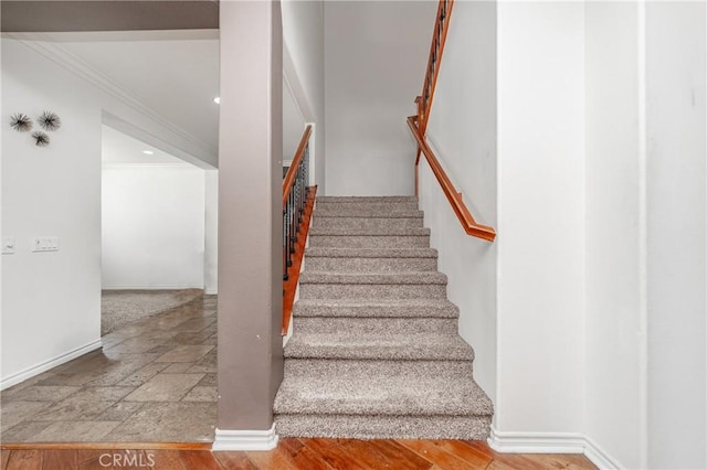 stairs featuring ornamental molding