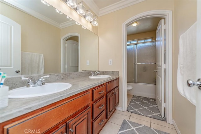 full bathroom featuring ornamental molding, toilet, tile patterned floors, bath / shower combo with glass door, and vanity