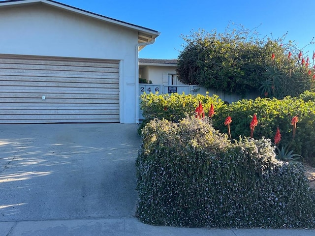 view of side of home with a garage