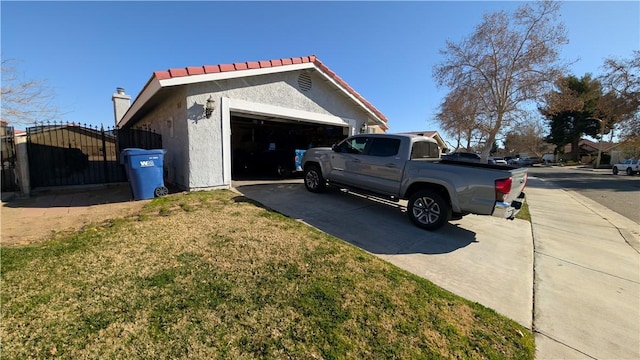 view of home's exterior with a yard and a garage