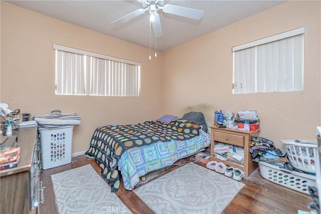 bedroom featuring hardwood / wood-style flooring and ceiling fan