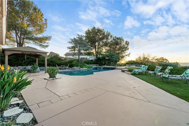 view of pool featuring a gazebo and a patio area