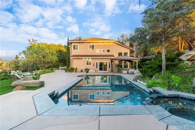 view of pool featuring an in ground hot tub, a gazebo, a patio, and a grill