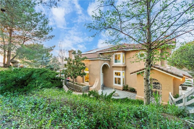 rear view of house with a patio area