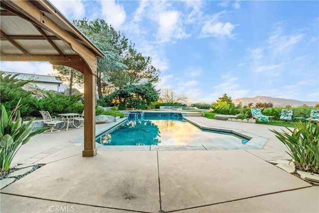 view of pool featuring a gazebo, a mountain view, and a patio