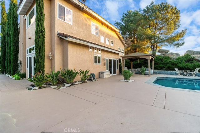 view of pool with a gazebo and a patio