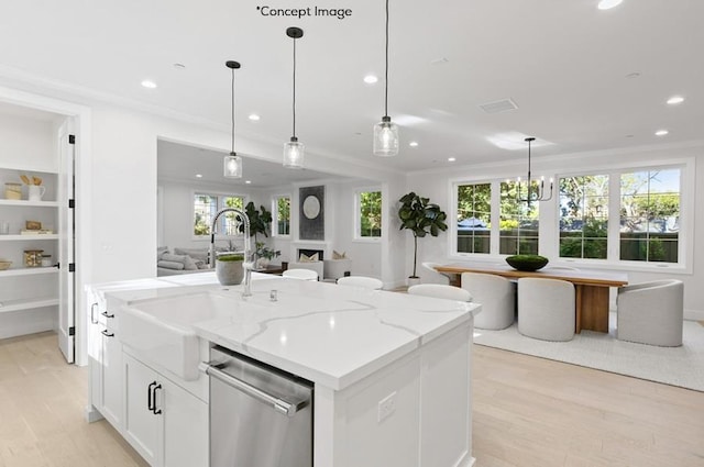 kitchen with light stone countertops, stainless steel dishwasher, a center island with sink, white cabinets, and hanging light fixtures