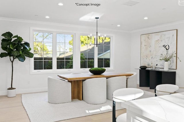 dining room featuring plenty of natural light, light wood-type flooring, crown molding, and a chandelier