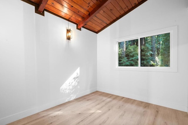 unfurnished room with wood ceiling, light hardwood / wood-style flooring, and lofted ceiling with beams