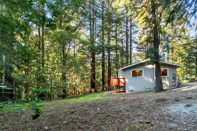 view of yard featuring a wooden deck