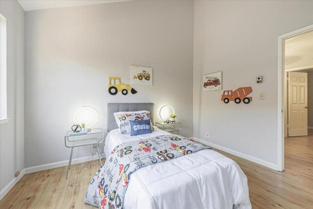 bedroom with light hardwood / wood-style flooring