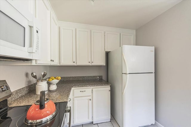 kitchen with white cabinets and white appliances