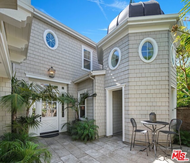 back of house with a patio