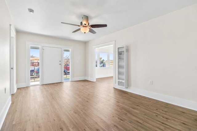 empty room featuring hardwood / wood-style flooring and ceiling fan