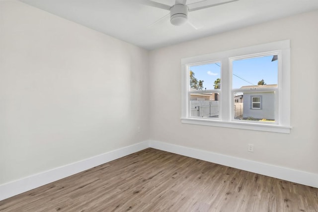 spare room with ceiling fan and hardwood / wood-style floors