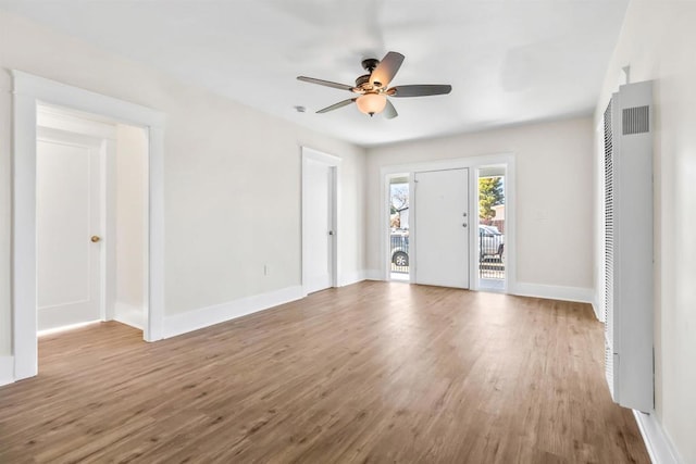 interior space with hardwood / wood-style floors and ceiling fan