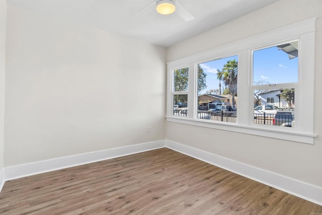 empty room with hardwood / wood-style flooring