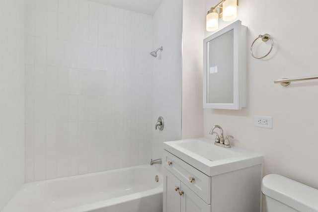 full bathroom with tiled shower / bath combo, vanity, and toilet