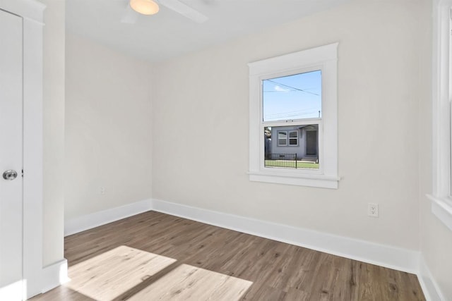 empty room featuring wood-type flooring and ceiling fan