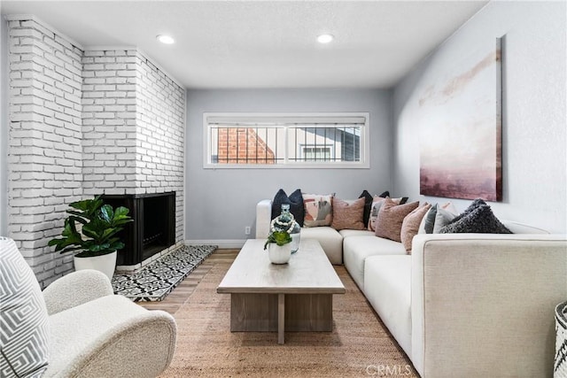 living room with a fireplace and hardwood / wood-style floors