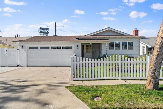 ranch-style house with a garage and a front lawn