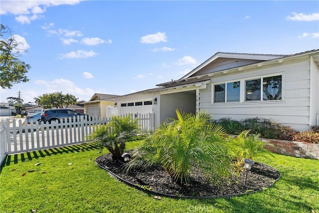 ranch-style house with a garage and a front lawn