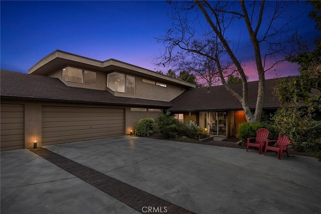 prairie-style home featuring a garage