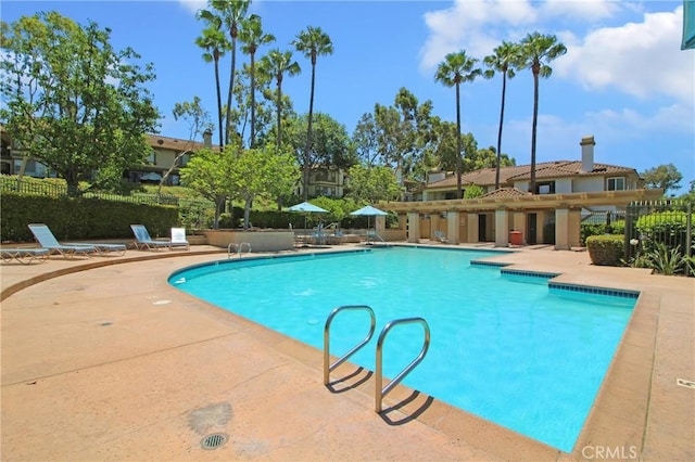 view of swimming pool featuring a patio