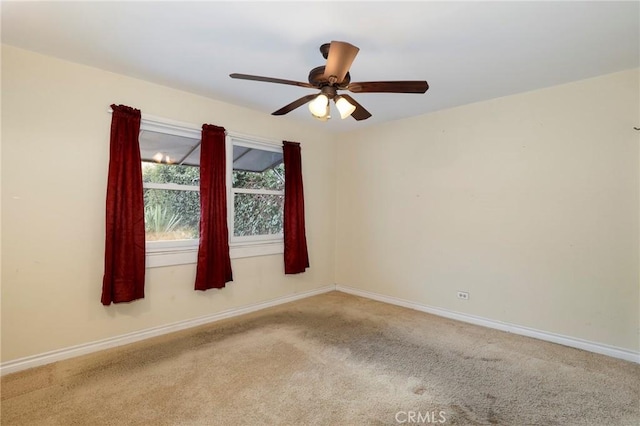 carpeted empty room with ceiling fan