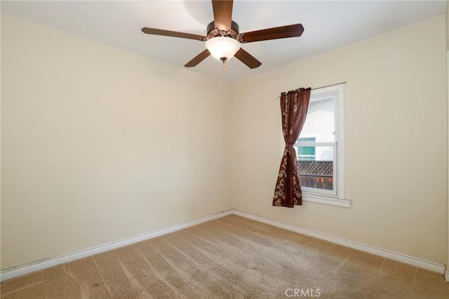 unfurnished room with ceiling fan and carpet floors