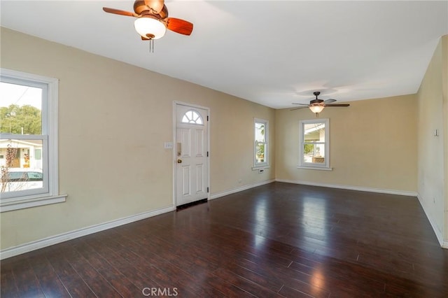 foyer with ceiling fan, dark hardwood / wood-style flooring, and a healthy amount of sunlight