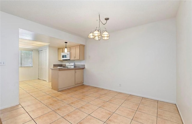 kitchen featuring light tile patterned floors, light brown cabinetry, an inviting chandelier, and pendant lighting