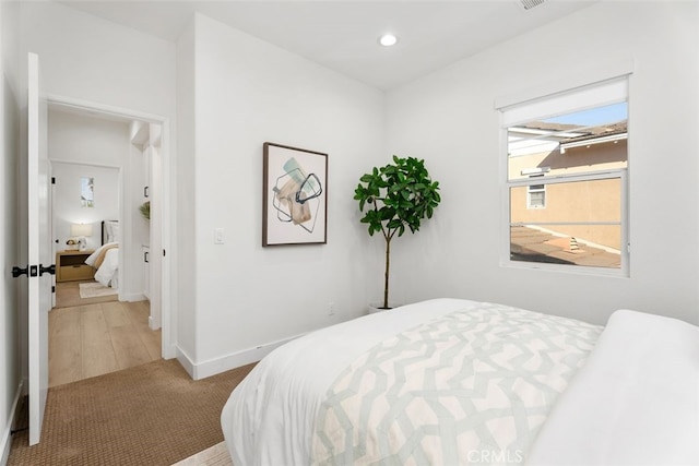 bedroom with light hardwood / wood-style flooring