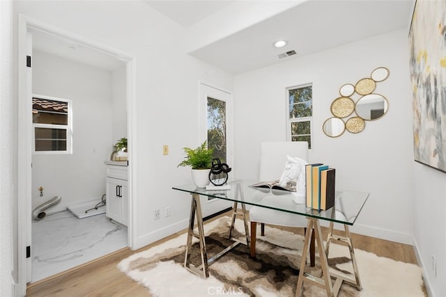 office with light hardwood / wood-style floors