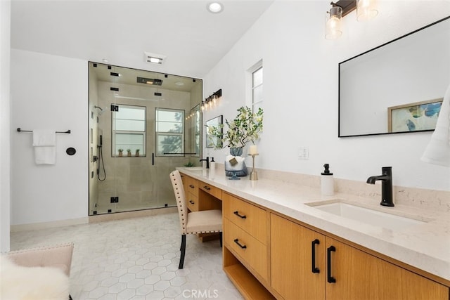 bathroom featuring tile patterned floors, a shower with shower door, and vanity