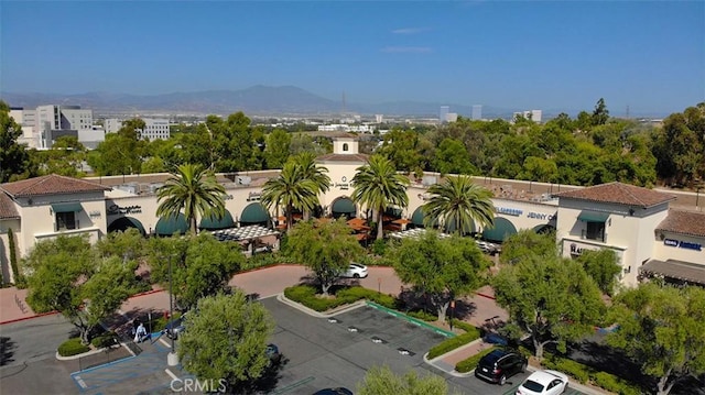 birds eye view of property with a mountain view