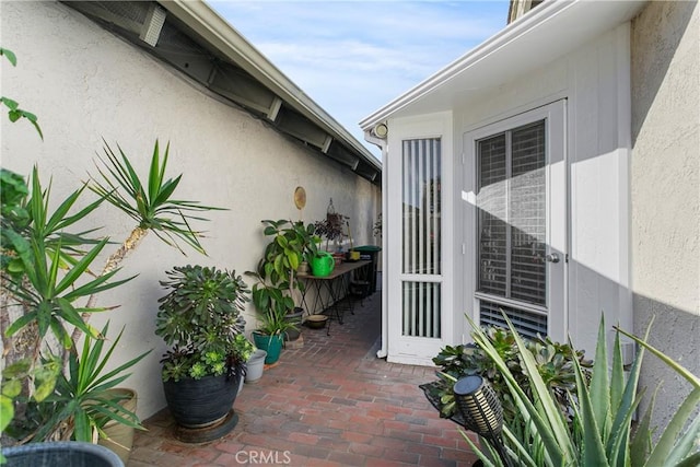 property entrance with a patio area