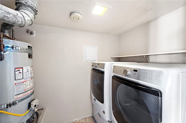 washroom with laundry area, secured water heater, and separate washer and dryer