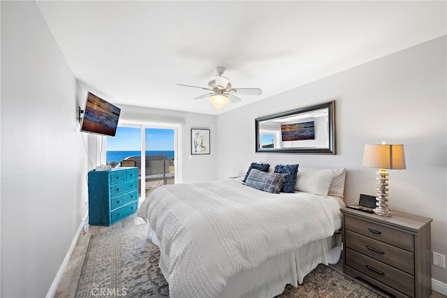 bedroom with baseboards, a ceiling fan, and access to exterior