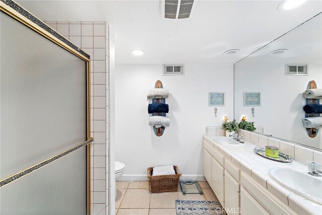 full bathroom featuring a sink, tile patterned flooring, and visible vents