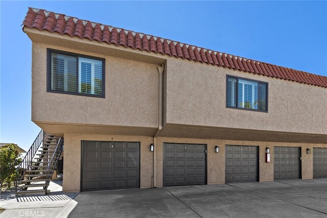 exterior space featuring concrete driveway