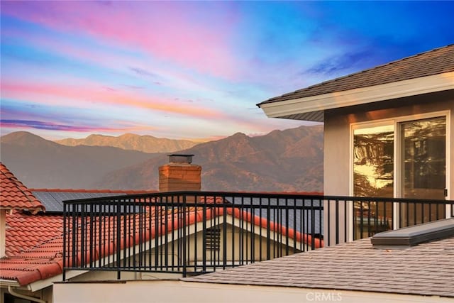 balcony at dusk with a mountain view